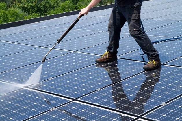 Demonstration of eco-friendly roof cleaning method used by Elite Roofing Noosa