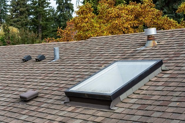 Shingle roof with expertly integrated skylight installation